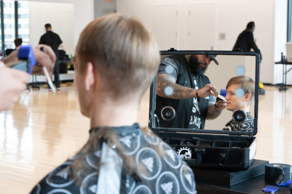 The back of a students head as they get their haircut