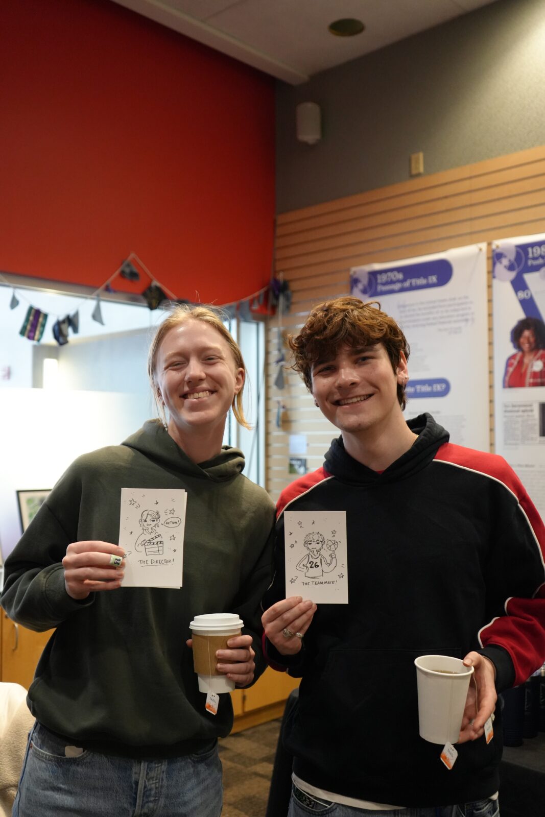 Students smile with their self portrait illustrations at the Day of Connection.