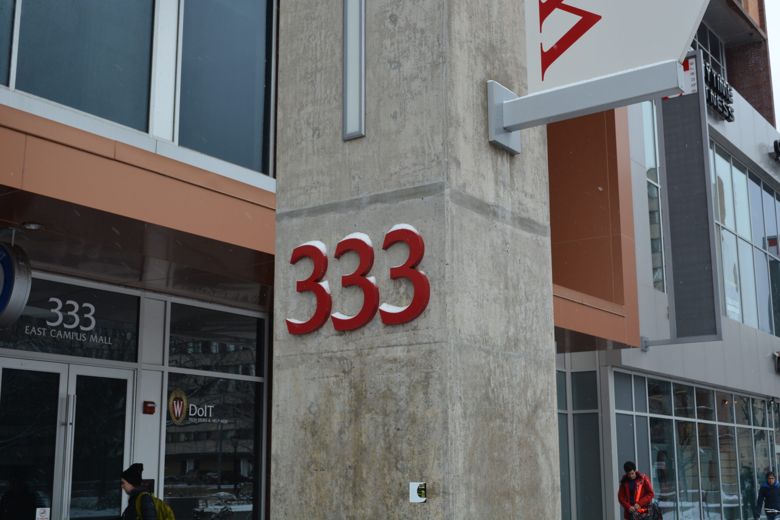 Close-up of exterior pillar in front of 333 East Campus Mall