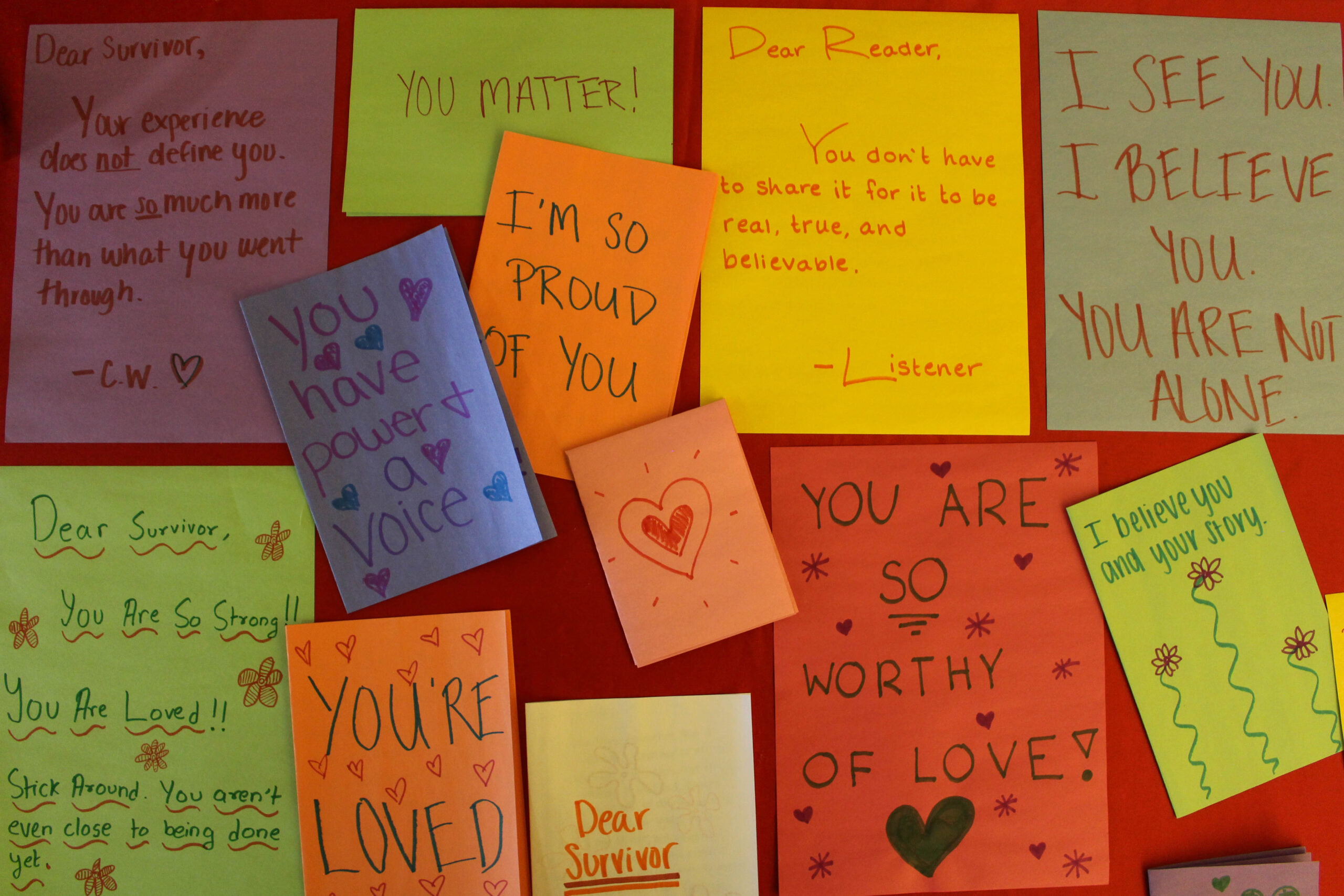 Colorful letters written to student survivors of sexual violence