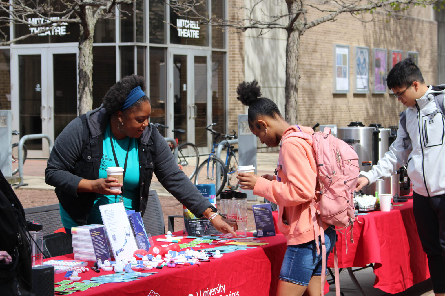 Survivor Services staff table and interact with students during the Sexual Assault Awareness Month resource fair.