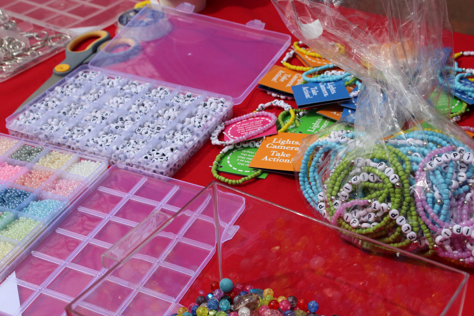 Friendship bracelet materials laid on a table as part of a bystander intervention campaign.