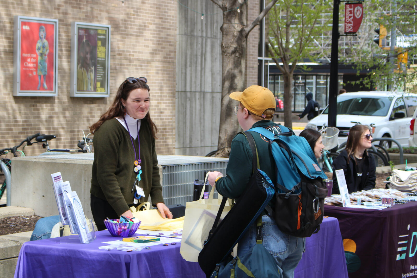 Community partner speaks to students at resource fair tabling event.