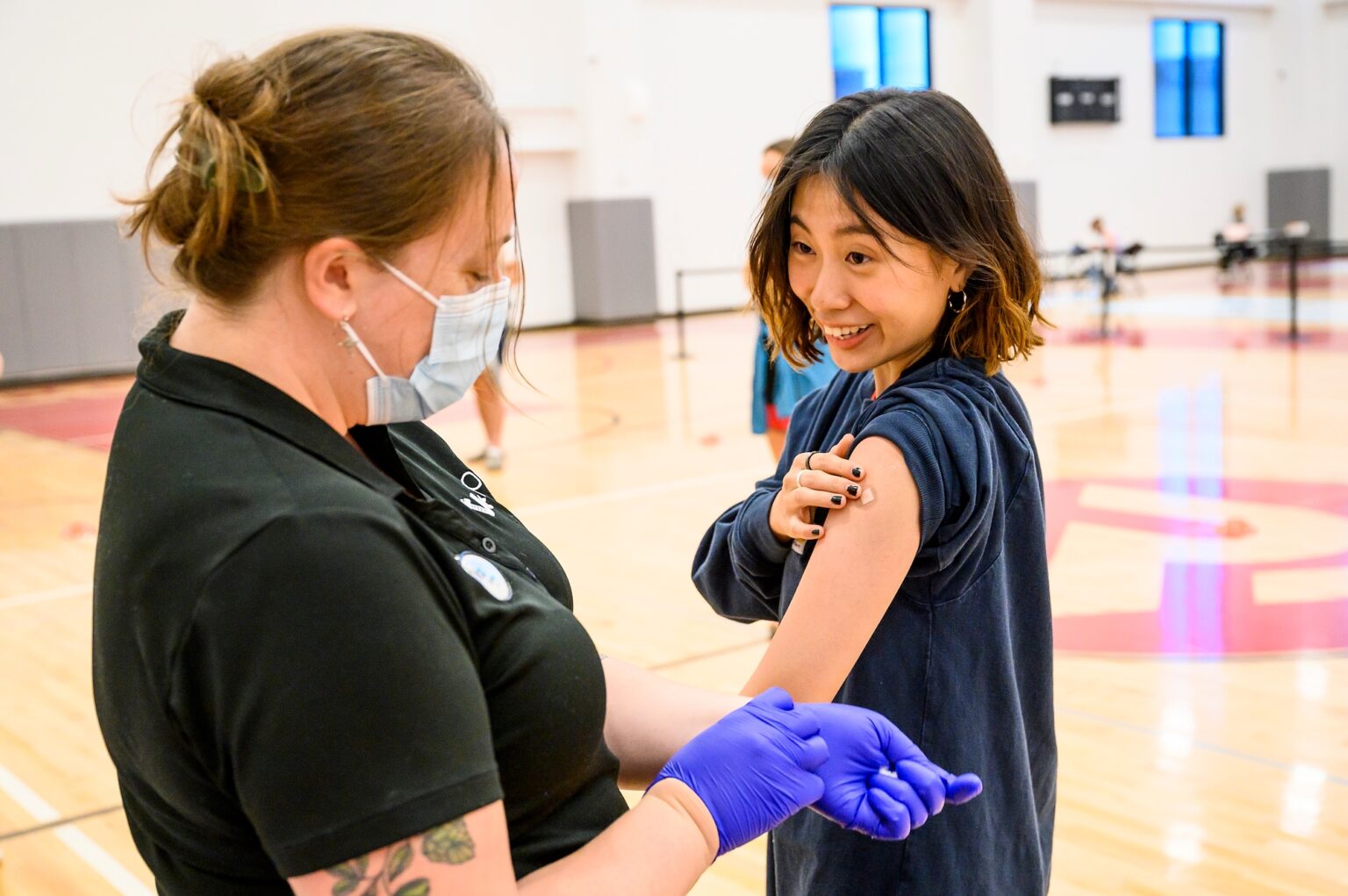 A patient receives a vaccine at a UHS vaccine clinic