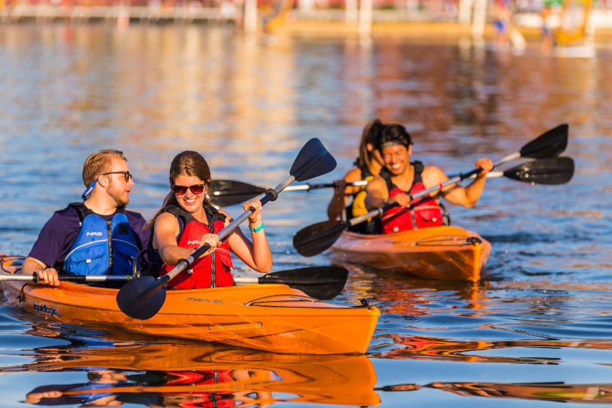 Outdoor UW students kayaking on Lake Mendota.
